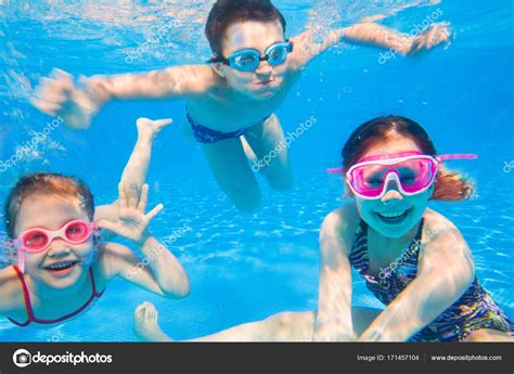 Little Children Swimming In Pool Stock Photo By ©yanlev 171457104