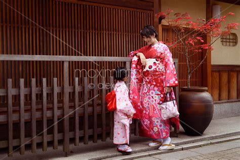 Photo Of Mother And Daughter Wearing Red Japanese Yuakata Kimonos On