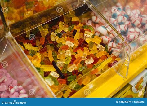 Bunch Of Assorted Gummy Candies On Boxes In Supermarket Stock Photo