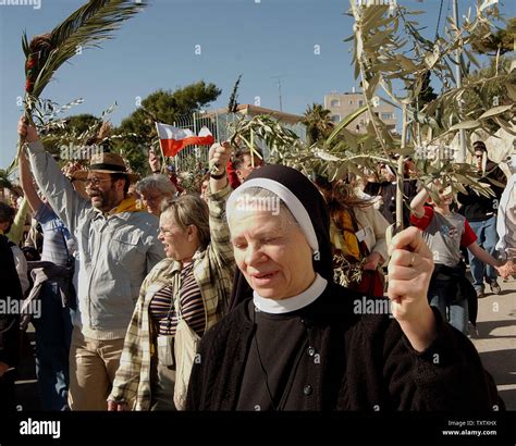 Christian Pilgrims Carry Olive And Palm Branches On The Mt Of Olives