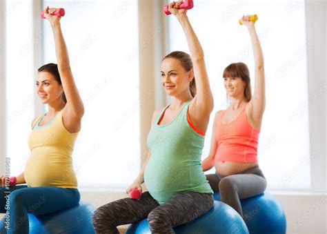 happy pregnant women exercising on fitball in gym stock foto adobe stock