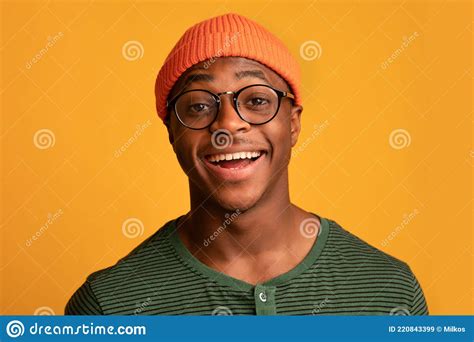 Closeup Portrait Of Cheerful Young Black Hipster Guy In Stylish