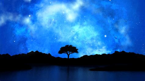 Tree Silhouetted Against A Starry Night Sky Photo Free