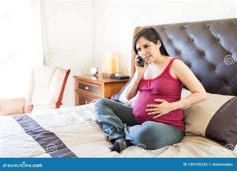 Pregnant Woman Feeling Contractions Calling For Help Stock Image