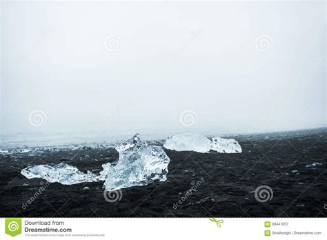 Icebergs On The Beach With Black Volcanic Sand In Iceland