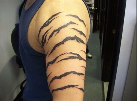 Tiger tattoos for men are the perfect representation of masculinity, power, and control. Pin by Peyton Nuñez on Tattoos | Stripe tattoo, Tiger ...