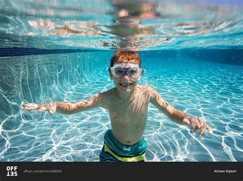 Underwater View Of Boy In A Swimming Pool Stock Photo Offset