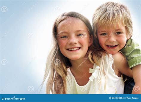 Pretty Girl Carrying Her Brother Against White Closeup Portrait Of A