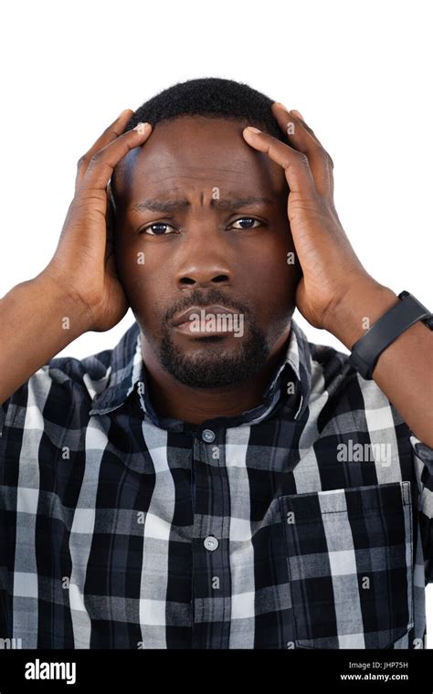 Portrait Of Confused Man Against White Background Stock Photo Alamy