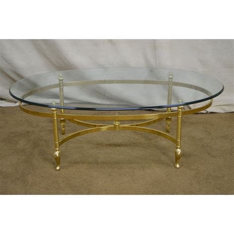 Crafted with a metal legs finished in gold, this piece features two. Ethan Allen Brass & Glass Oval Coffee Table | Chairish