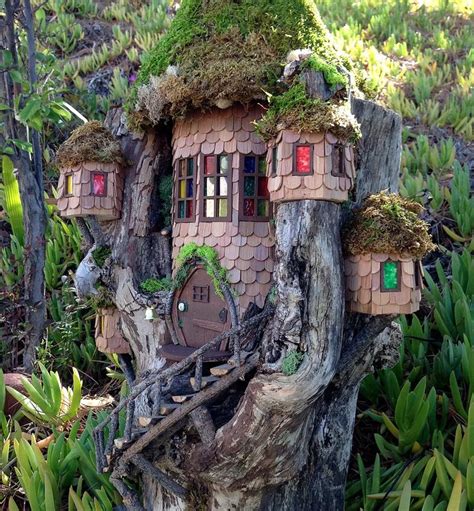 Unique Fairypixie Houses Built Into Fallen Logs Each Having Its Own