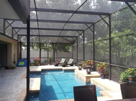 Mansard Style Pool Screen Enclosure And Pavers By Design Pro Screens