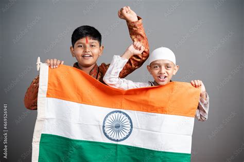 Happy Hindu Muslim Kids Shouting As India By Holding Indian Flag On