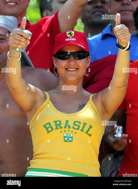 A Female Brazilian F1 Fan Thumbs Up Before The F1 Grand Prix Of Brazil At The Racetrack In