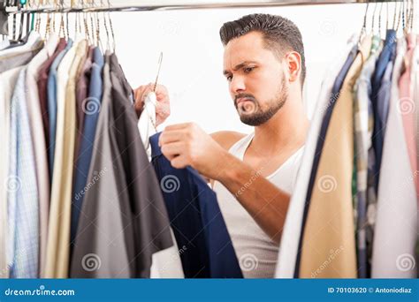Young Man Deciding What Clothes To Wear Stock Photo Image Of Bedroom