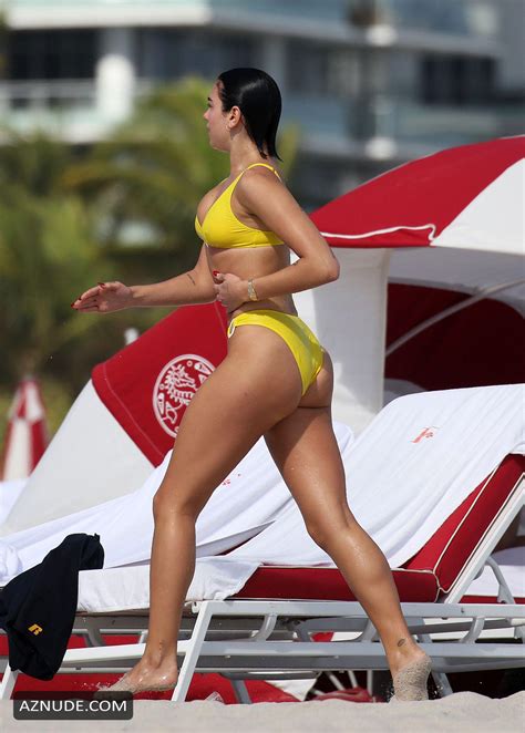 Dua Lipa Sexy In Yellow Bikini As She Takes Dip In The Ocean With Her