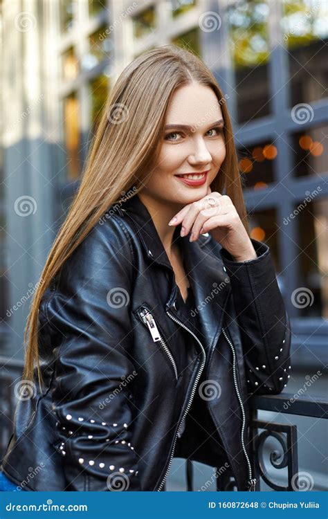 Face Portrait Of Attractive Woman In Black Leather Jacket Stock Photo