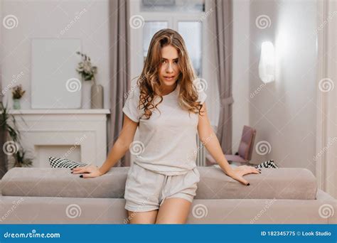 Lovable Female Model Cute Pajamas Standing In Confident Pose In Her