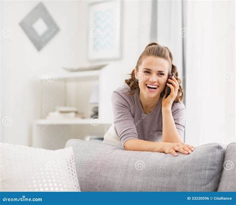 Happy Young Woman Talking Cell Phone In Living Room Stock Photo Image