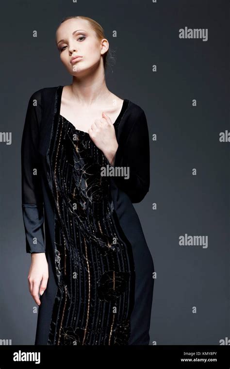 Portrait Of A Beautiful Elegant Model In Black Dress Posing Stock