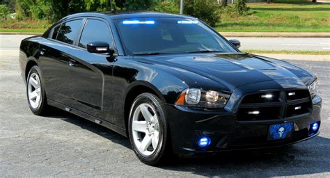 We have a local unmarked crown vic that all the windows are blacked out. unmarked police charger - Google Search | Police cars, Car ...