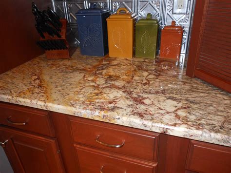 Typhoon Bordeaux Granite Countertop With Tin Backsplash