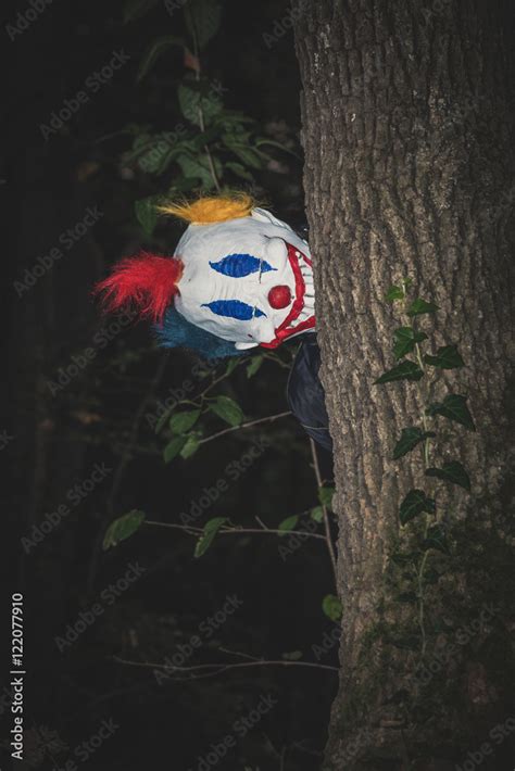 Scary Clown Behind Tree Stock Photo Adobe Stock