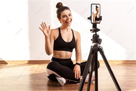 Fitness Trainer Records Online Tutorial With Tripod And Phone Photo