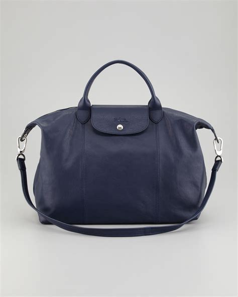 Every season brings a new collection that delivers a fresh update to the instantly recognizable le pliage bag structure. Lyst - Longchamp Le Pliage Cuir Large Tote Bag in Blue