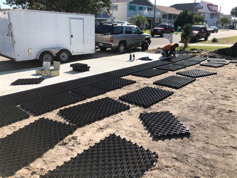 Grass sprouting from gravel on ground. EasyPave Grid - Grass / Gravel Paving System | Dog yard ...