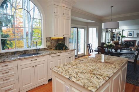Are you looking for white granite countertop ideas? Traditional style kitchen with granite countertops and a ...
