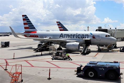 If you plan on traveling with your pet, you should taking the cat out of her carrier at dfw security was uneventful and the gate agent let my elderly father board early to get situated with the cat. American Airlines A319 | American airlines, Airlines, American
