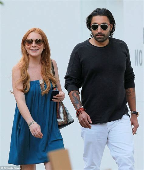 Lindsay Lohan Wears Peek A Boo Dress And No Bra To Hang Loose With