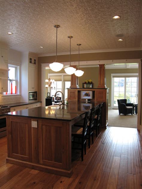 Rather than reinstalling a flat ceiling, similar to the existing one, the homeowner wondered if it was possible to do something more interesting. Innovative schoolhouse lighting in Kitchen Traditional ...