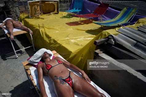 Women Sunbathe Using Insulating Tape At A Beauty Center In Belo