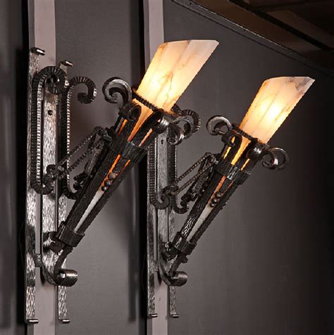 Wrought iron is more then just railings. wrought iron art deco sconces - Decoist
