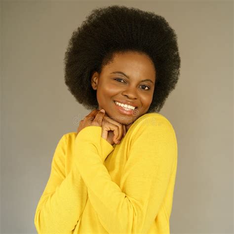 Happy Afro American Millennial Woman With Afro Hair Style Wear Yellow