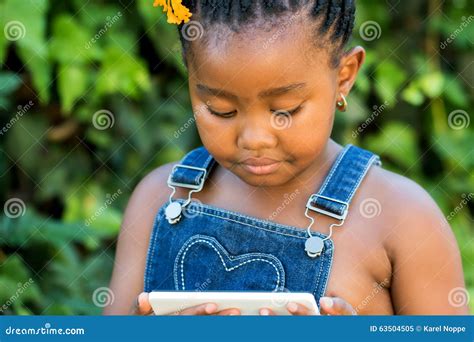 Little Black Girl Looking At Tablet Outdoors Stock Image Image Of