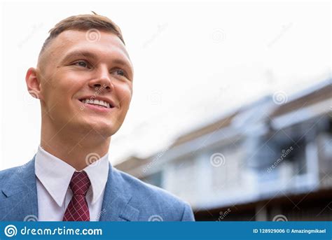 Portrait Of Young Businessman In The Streets Outdoors Stock Photo