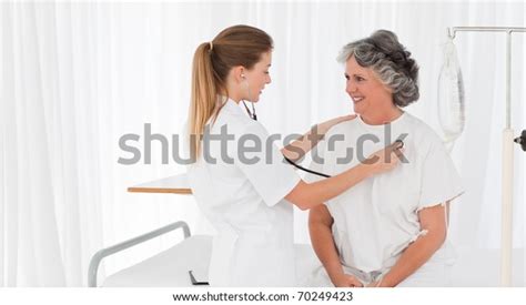 Nurse Taking Heartbeat Her Patient Stock Photo 70249423 Shutterstock