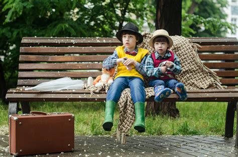 Two Kids Sitting On Brown Bench · Free Stock Photo