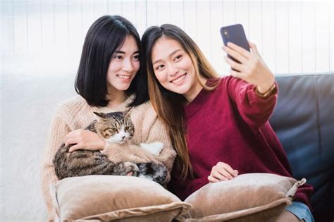 Premium Photo Young Beautiful Asian Women Lesbian Couple Lover Using Smartphone Selfie Cute