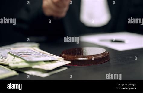 Corrupt Judge Striking Hammer Three Times Dollar Bills Lying On Court