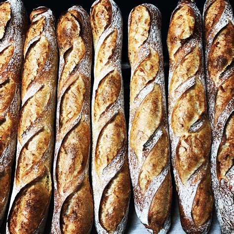 A long narrow loaf of french bread. Baguette Tradition - Boulangerie et biscuiterie artisanale ...