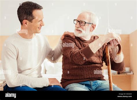 Delighted Brunette Putting His Hand On Shoulder Stock Photo Alamy