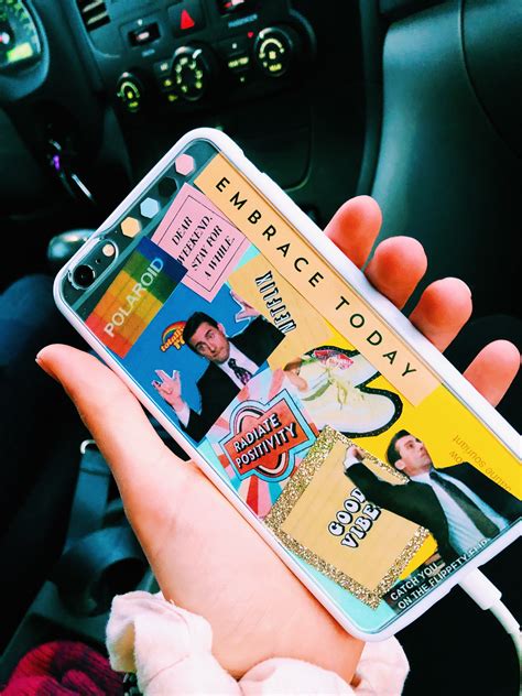 A Person Holding Up A Cell Phone Case With An Advertisement On The