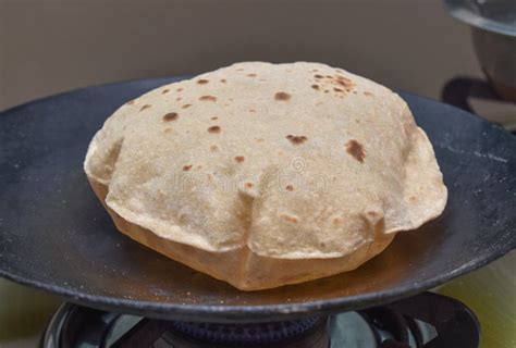 Making Roti Indian Chapati On Roti Tawa Made Of Wheat Dough Stock Photo