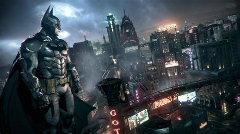 Download Batman Standing Over The Building Of Arkham City 4k Wallpaper