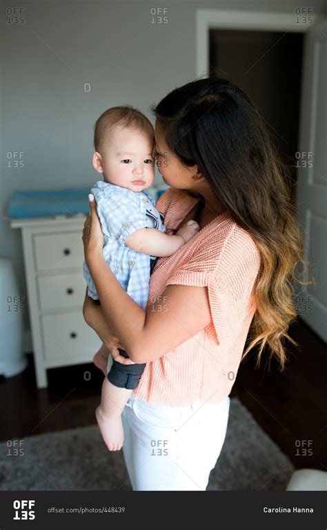 Mom Holding Her Toddler Son Snuggling Him Stock Photo Offset