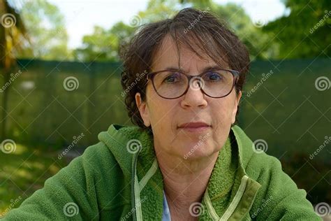 portrait of a mature brunette woman with eyeglasses outdoor stock image image of cute